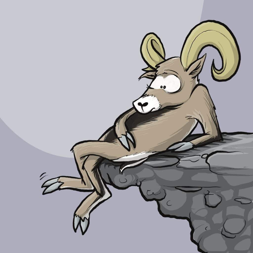 A tan bighorn sheep with curled horns lounges on a rocky ledge, staring off with a faraway look.