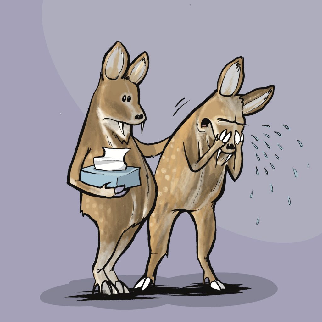 A spotted musk deer with small fangs offers a box of tissues and a comforting hand to a sobbing friend.
